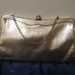 A  shimmering gold handbag